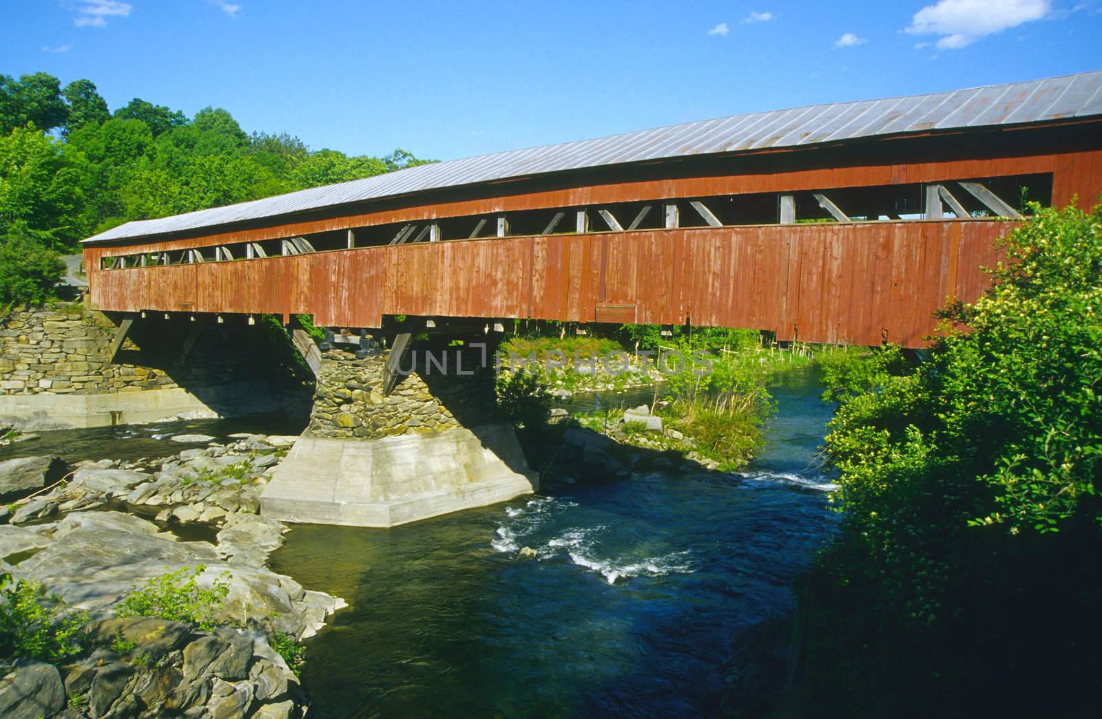 Covered bridge painted red in Taftsville, Vermont, USA