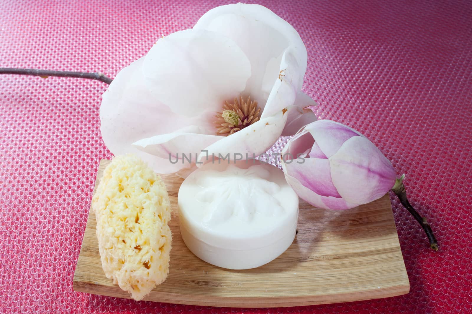 Various scented soaps and white flower