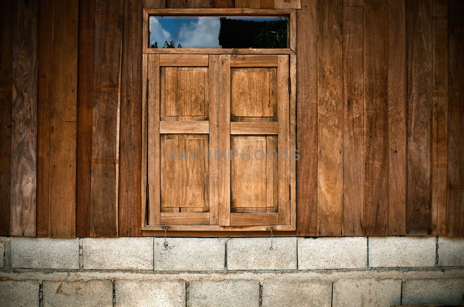 Close old wood twin window on the wall