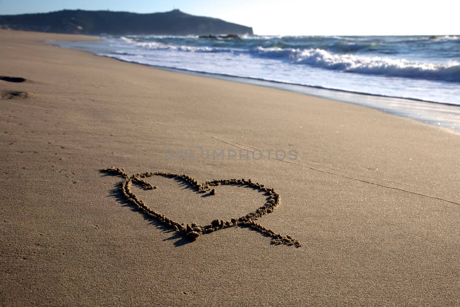 Valentine's Day heart with cross on the beach horizontal