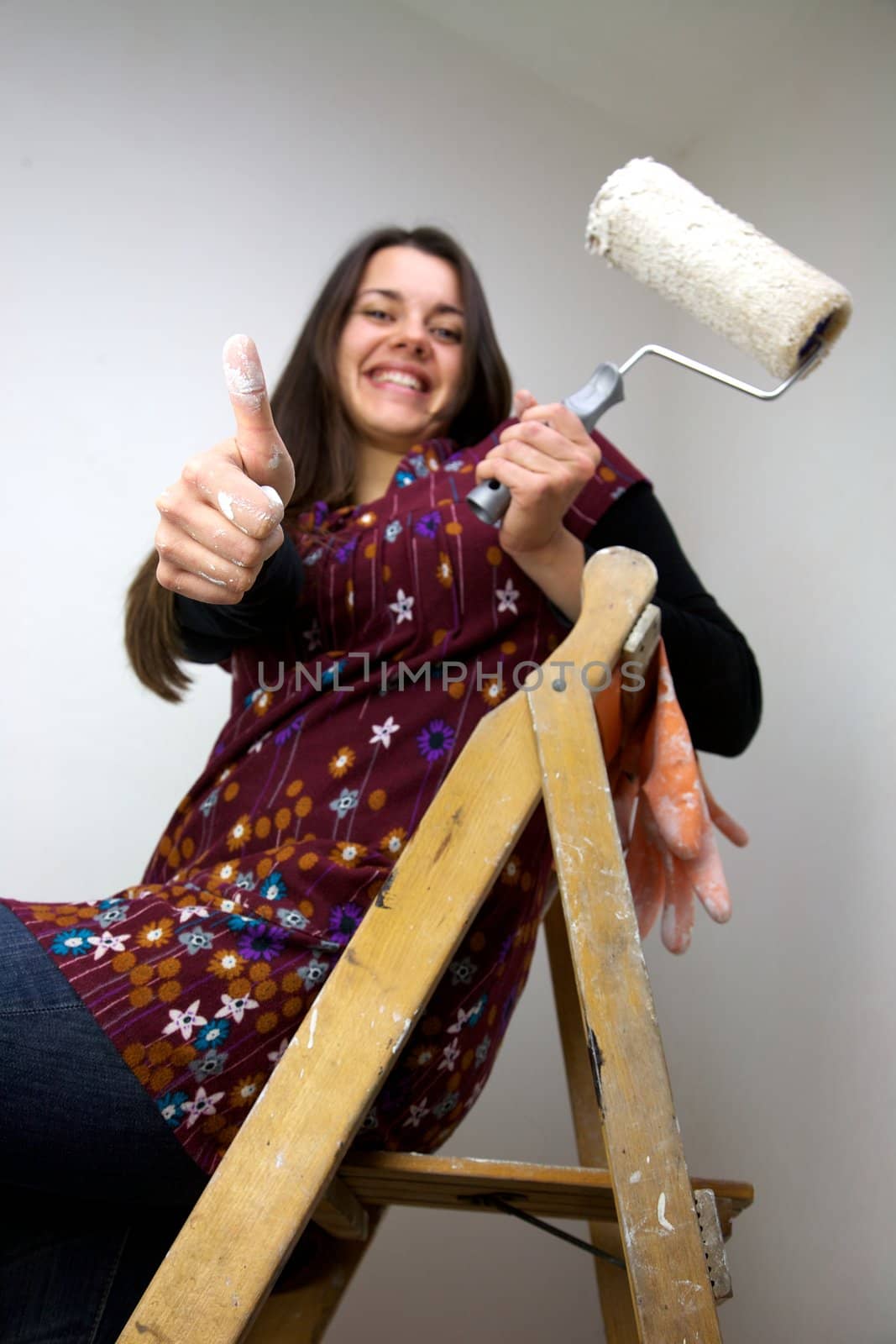 italian woman painting and showing white thumb up by fmarsicano