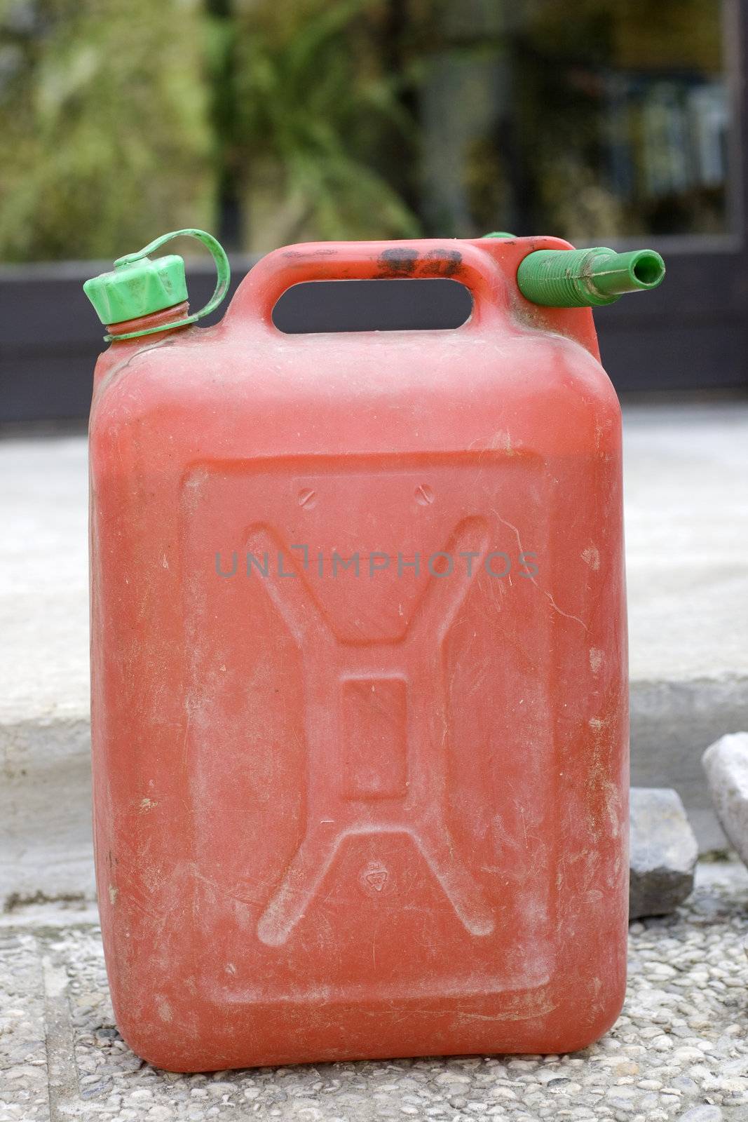 Red petrol can on the street