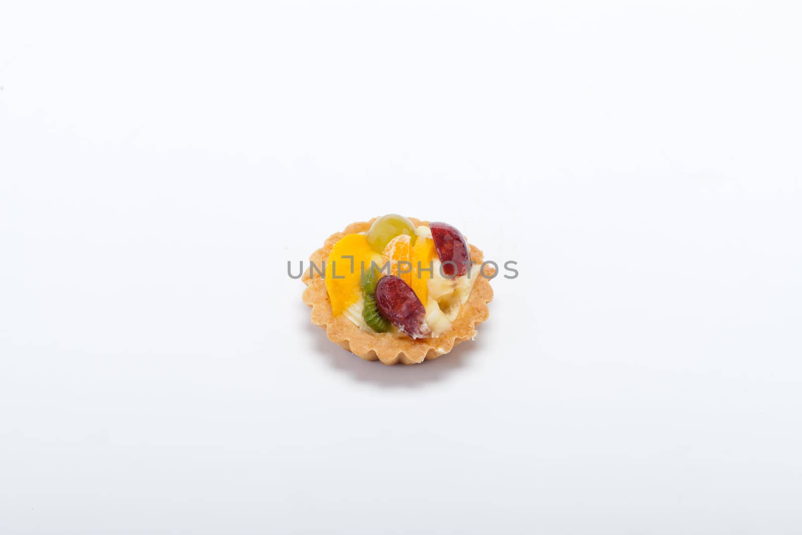 sweet cake with fruits isolated on white