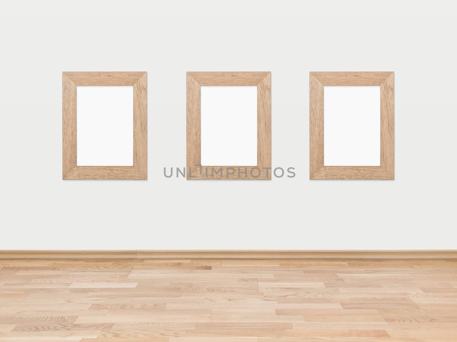 Empty wooden frames on a white wall by bloomua