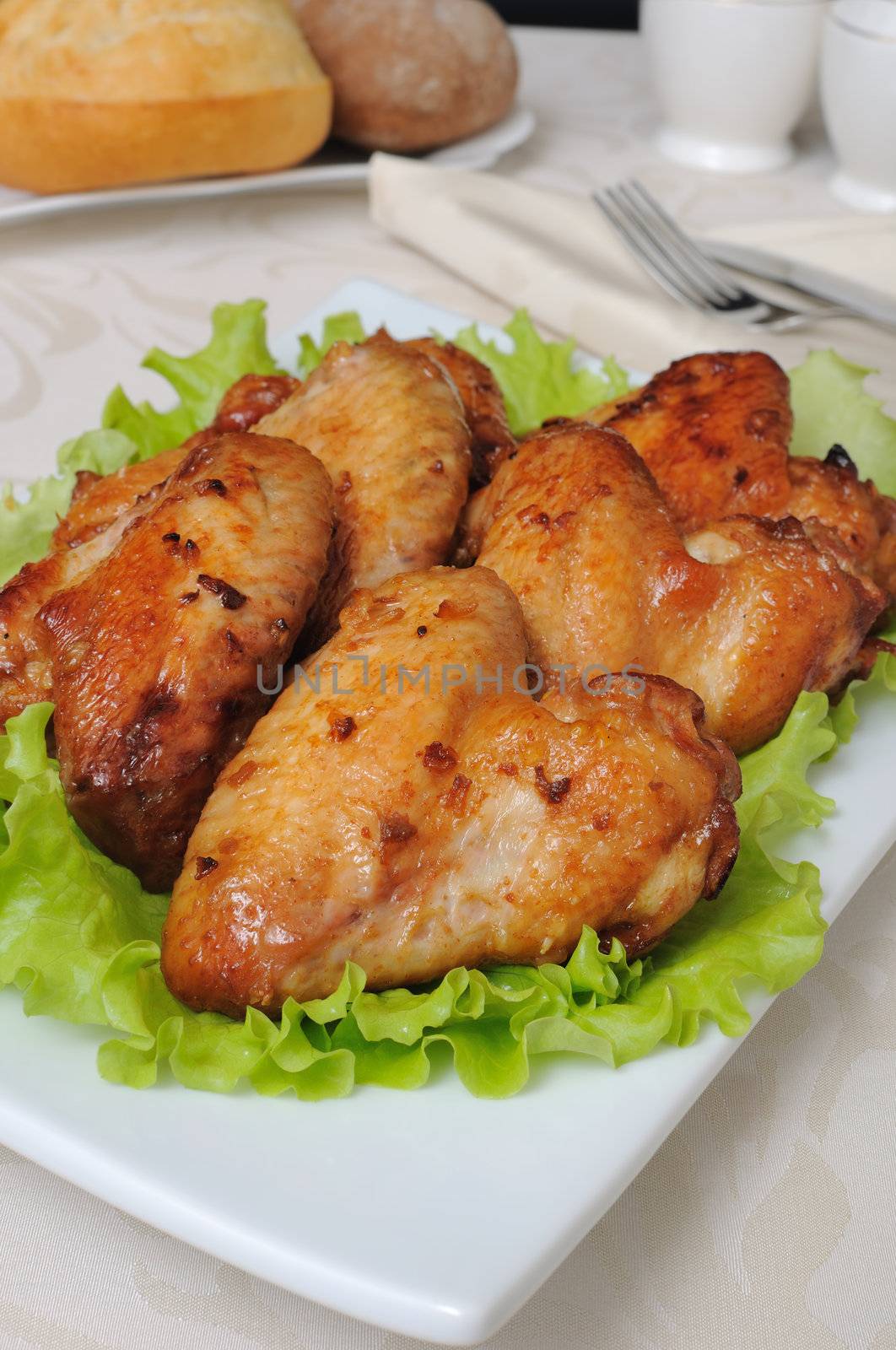 Baked chicken wings in honey and soy marinade with garlic