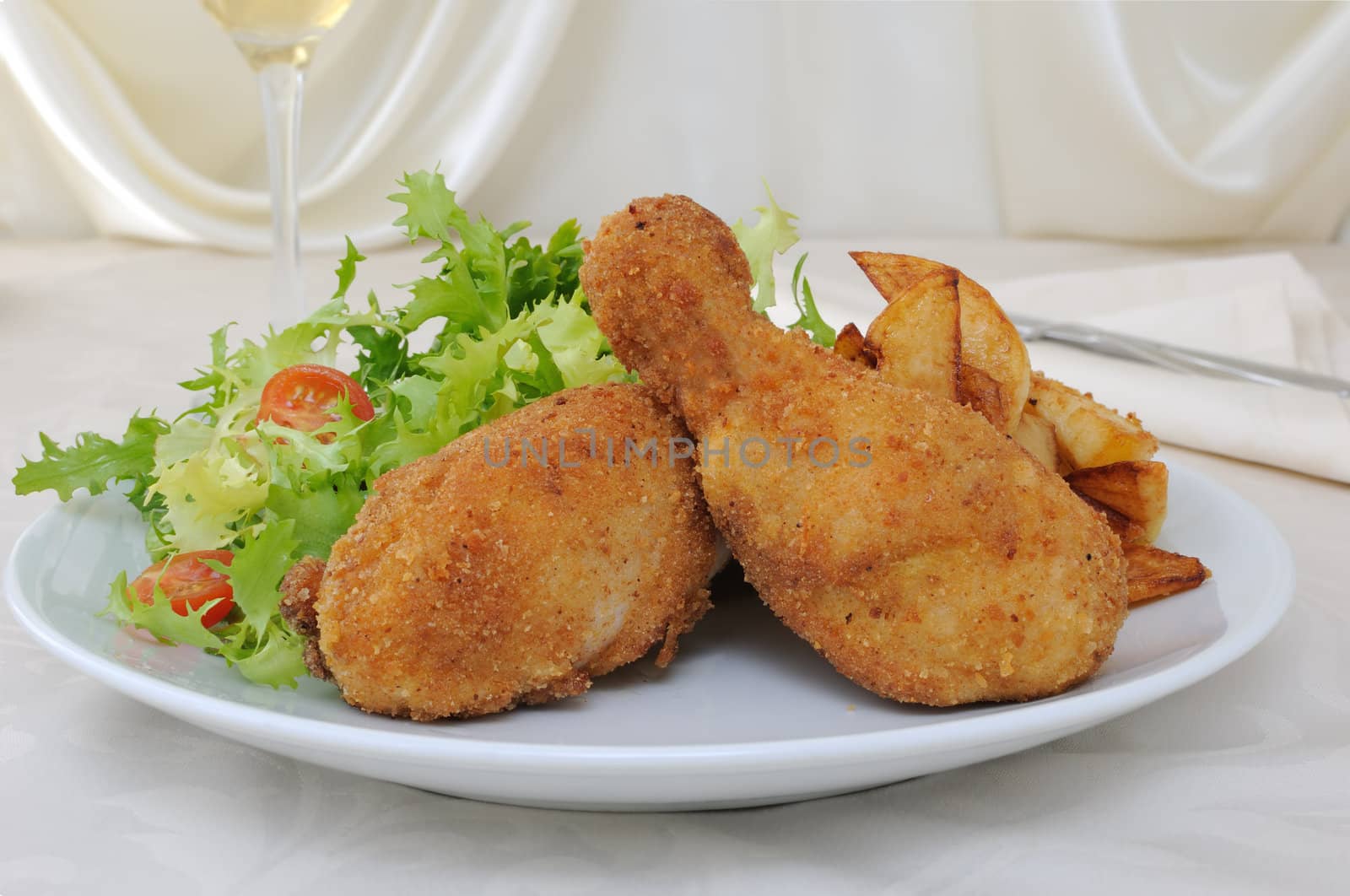 Chicken drumsticks in breadcrumbs with chips   with salad