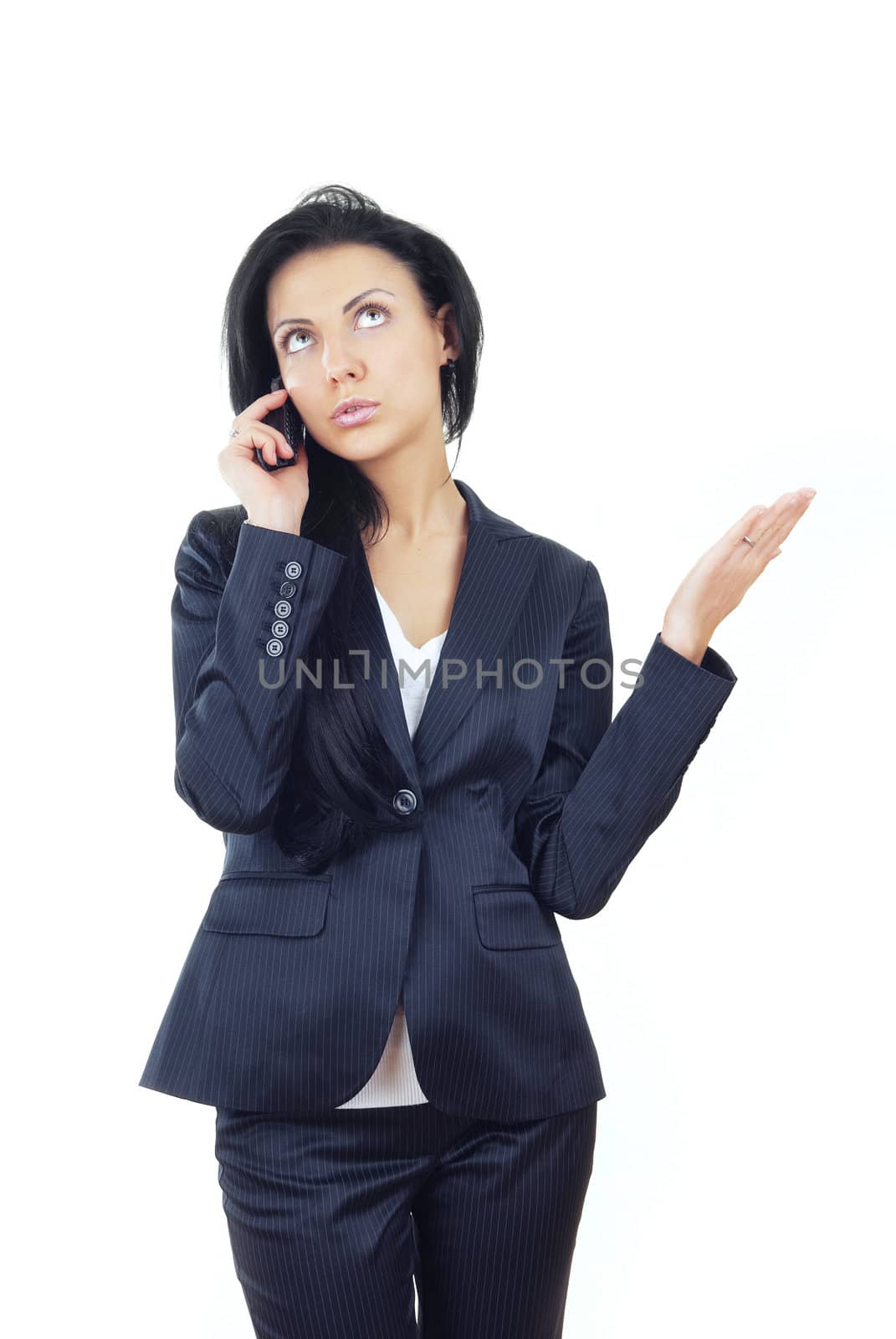 Businesswoman talking via cell phone on a white background