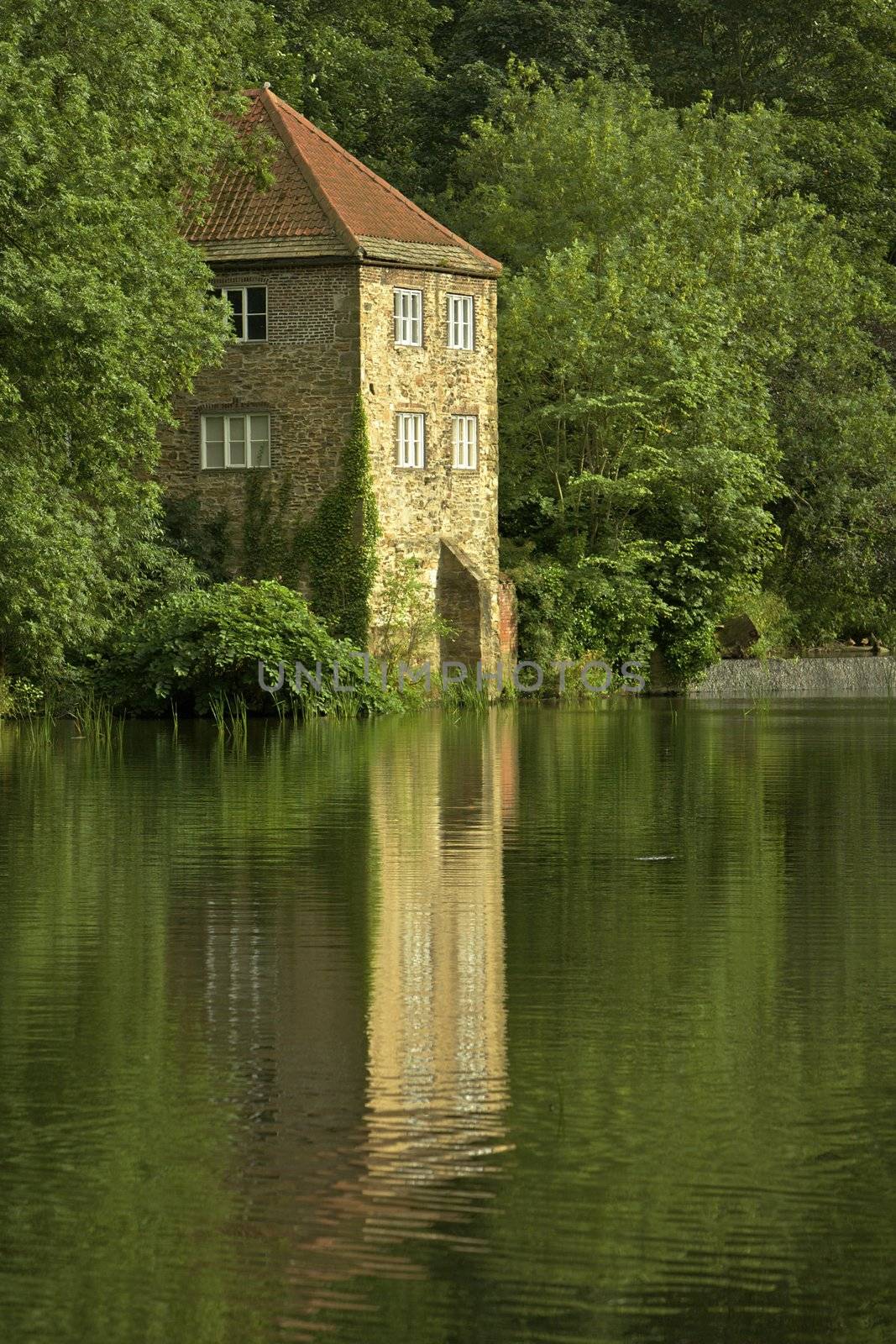 Durham, old pump house on river bank in England