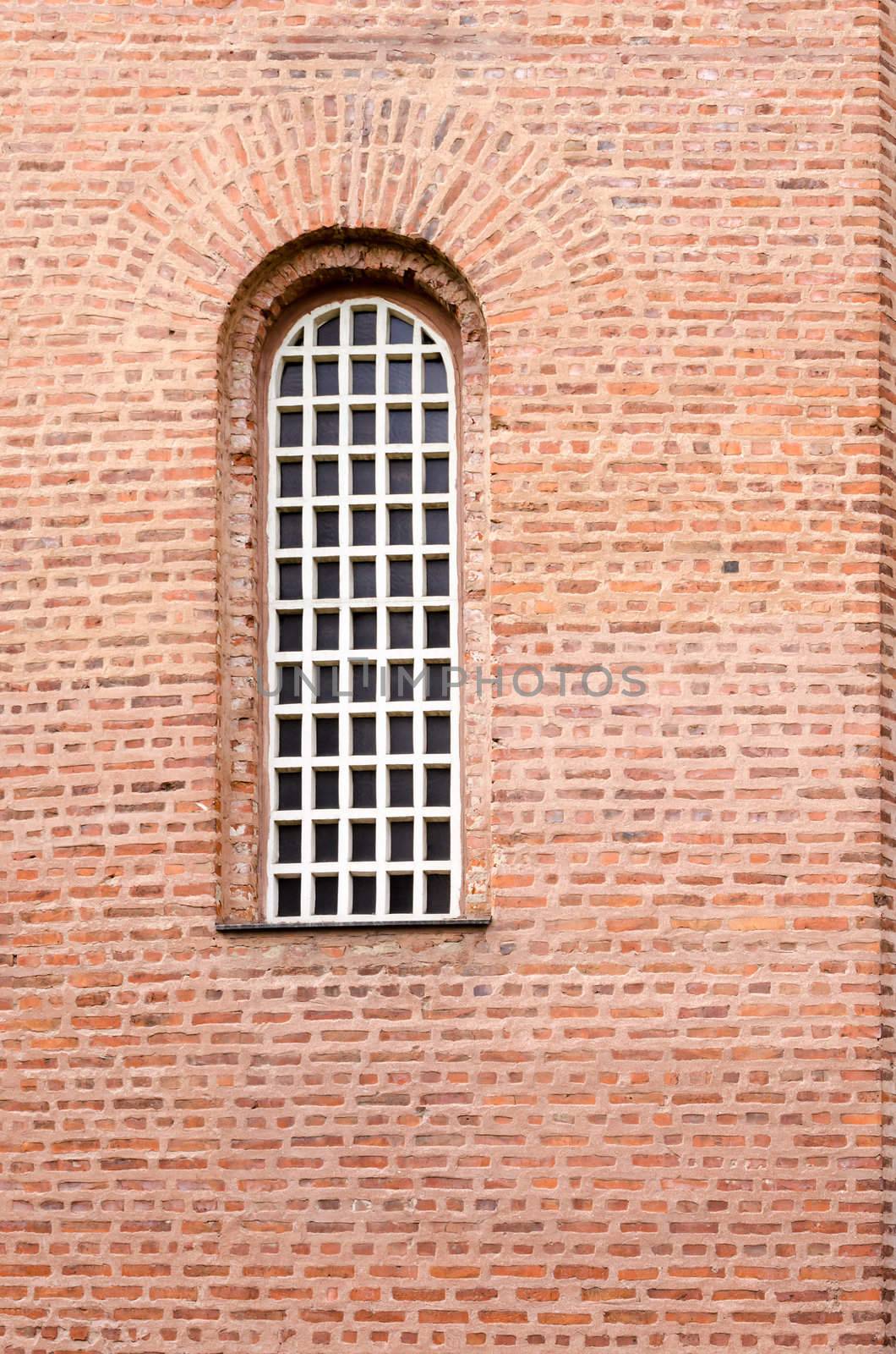 A window and a texture of a wall with red bricks by velislava