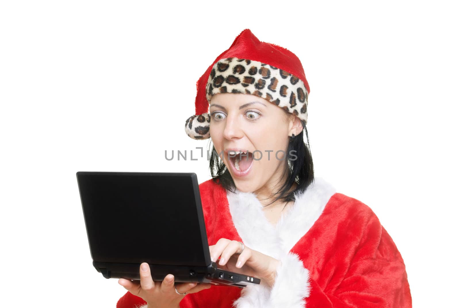 Screaming lady in Santa Claus costume working on laptop