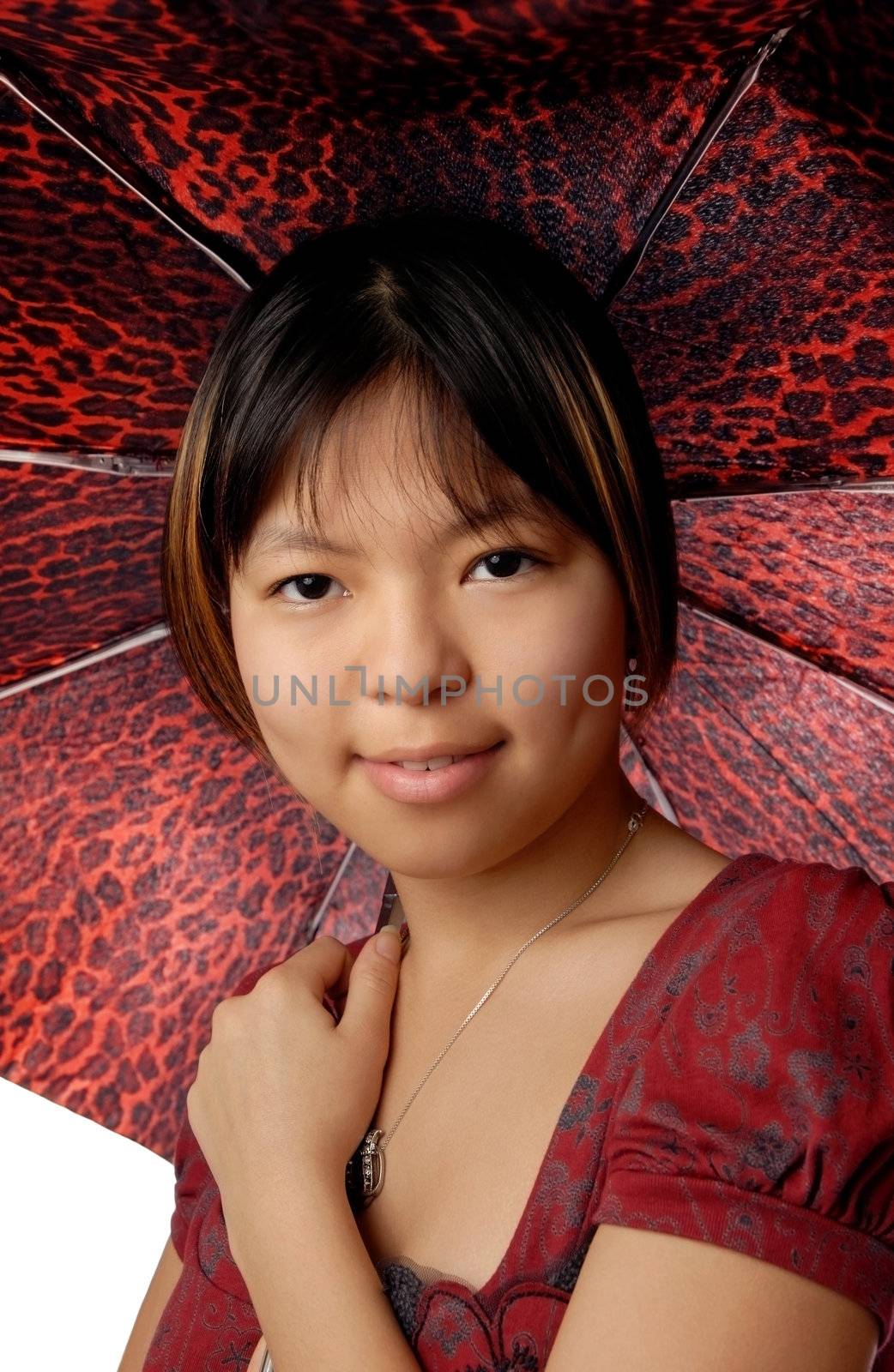 Cute Asian girl with red spotty fashionable umbrella