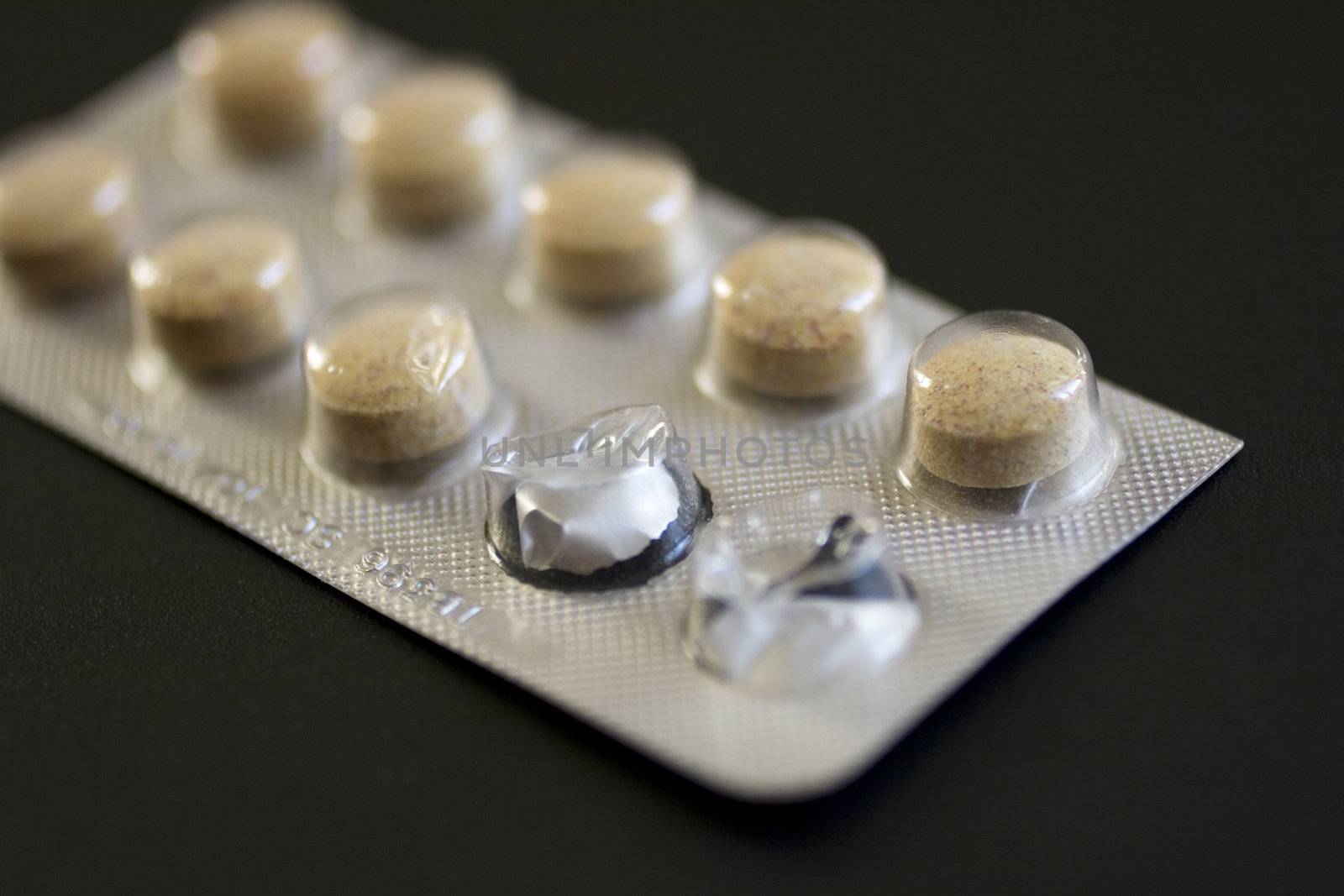 Pills on black background