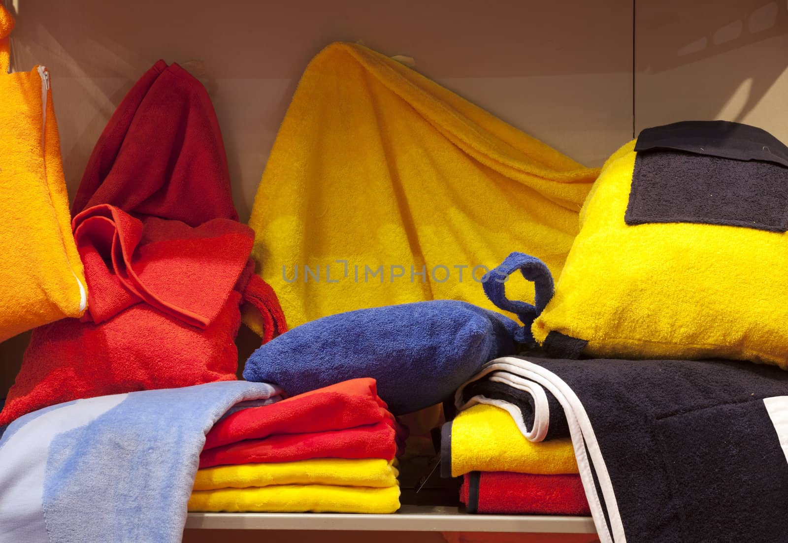Colorful bathrobe and towels in a shop