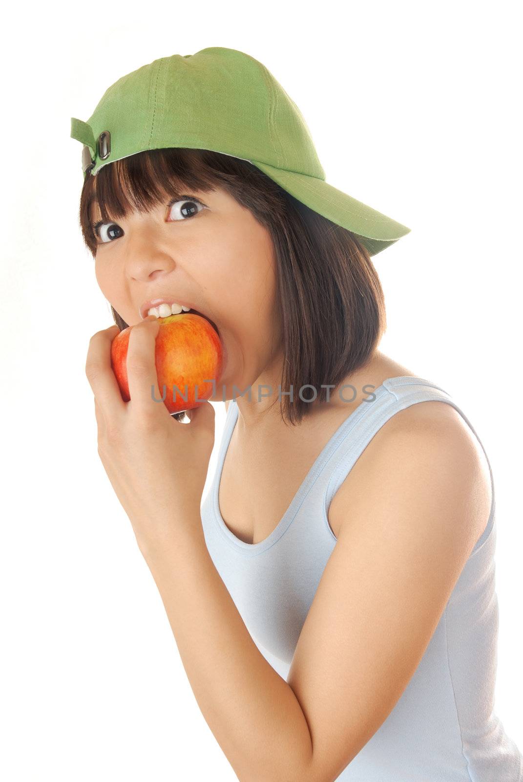 Photo of the hungry model eating fresh apple