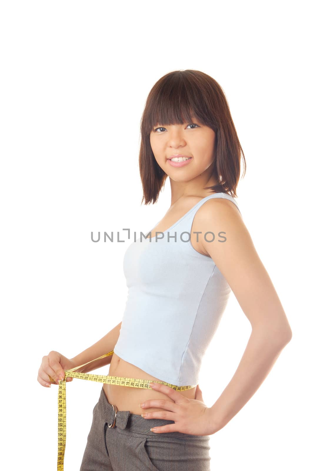 Photo of the smiling model with tape measure on her beltline