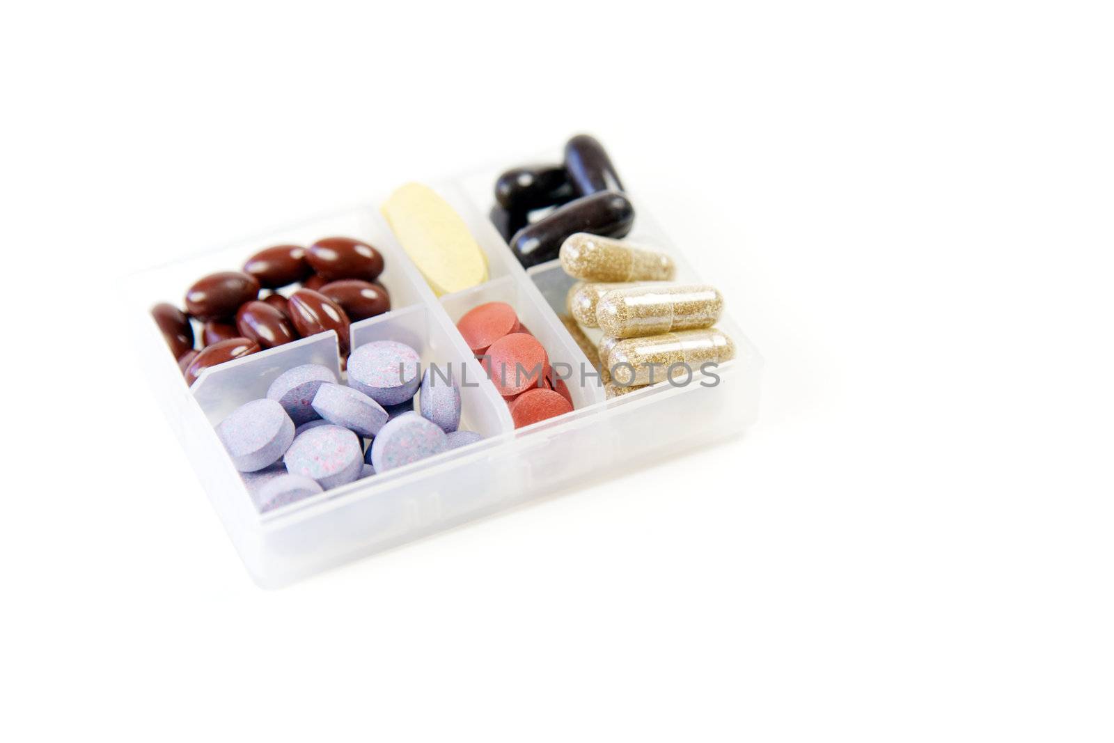 Pills and capsules in a container 