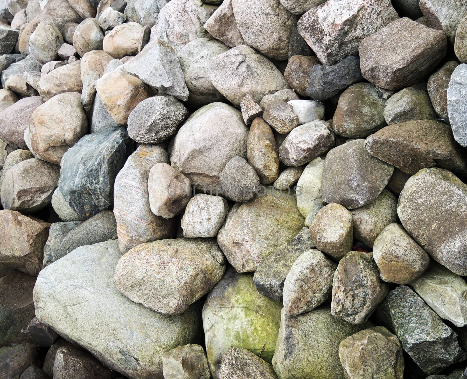 Natural wall of big granite rock stones