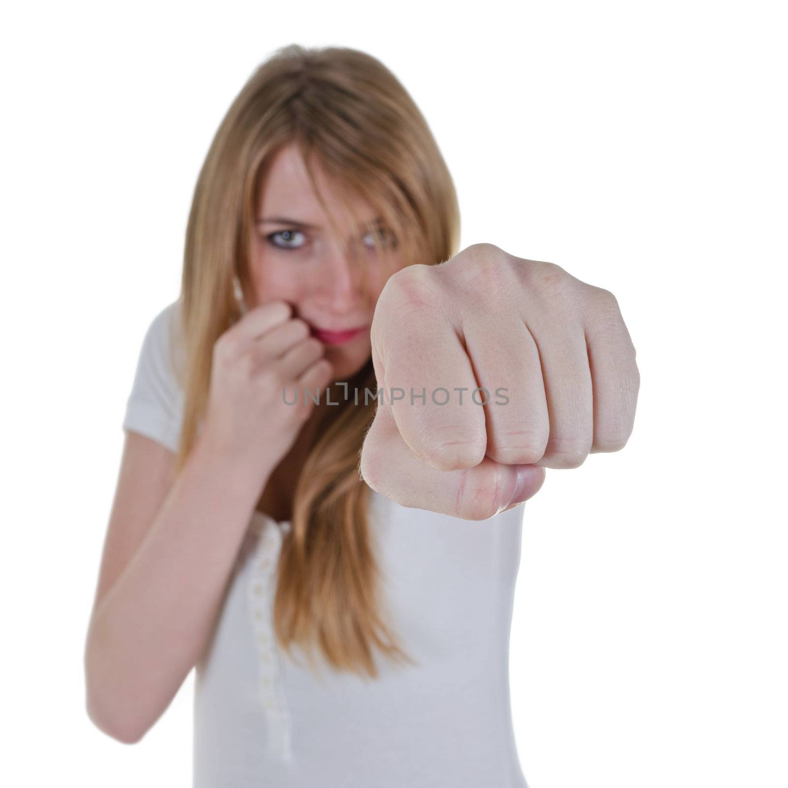 woman kickboxer kick out with left hand, isolated over white, focus on fist