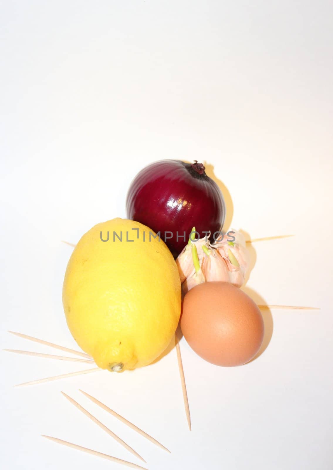 egg, red onoin, lemon and garlic isolated on white bacground