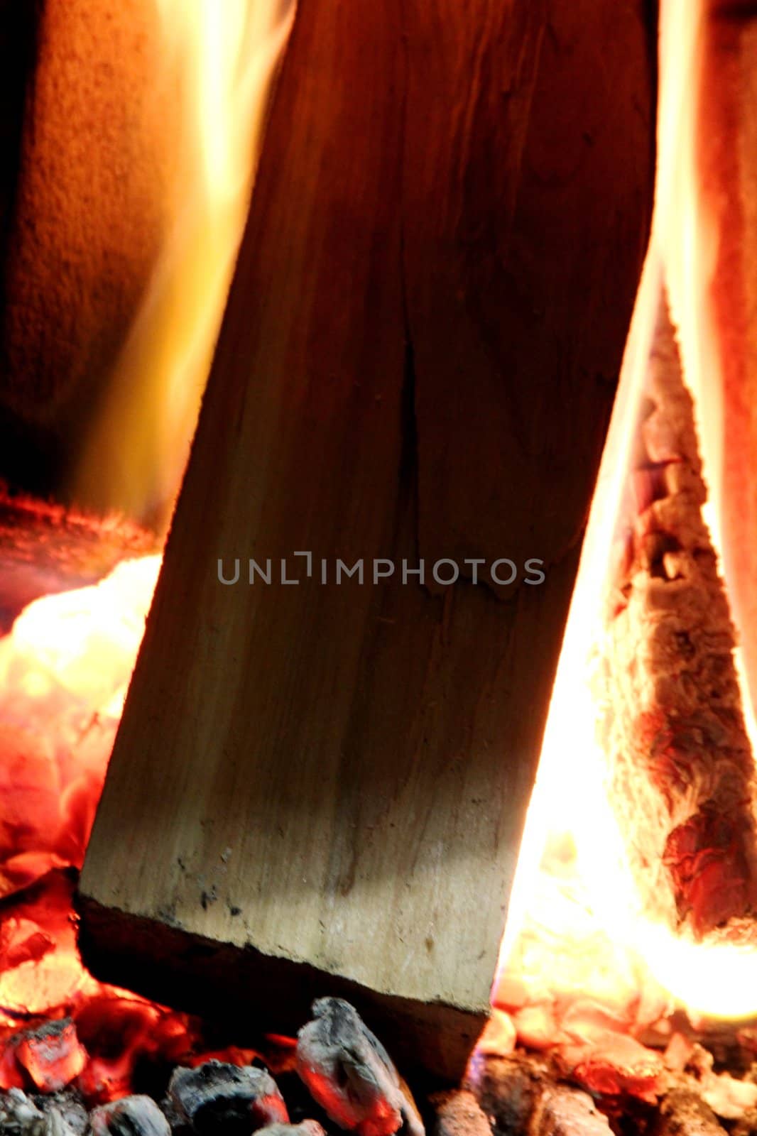 Beautiful wood burning in the fireplace red coals