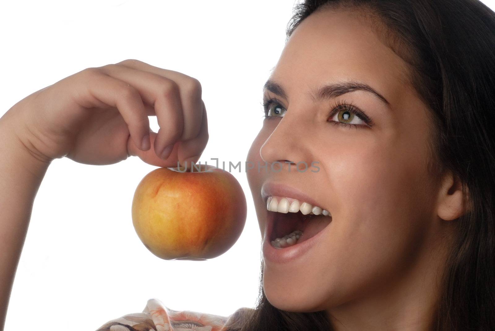 Photo of smiling model with good teeth and pure apple