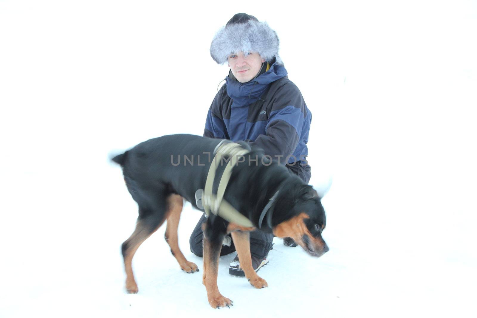 Men with rottweiler. Winter. isolated on white