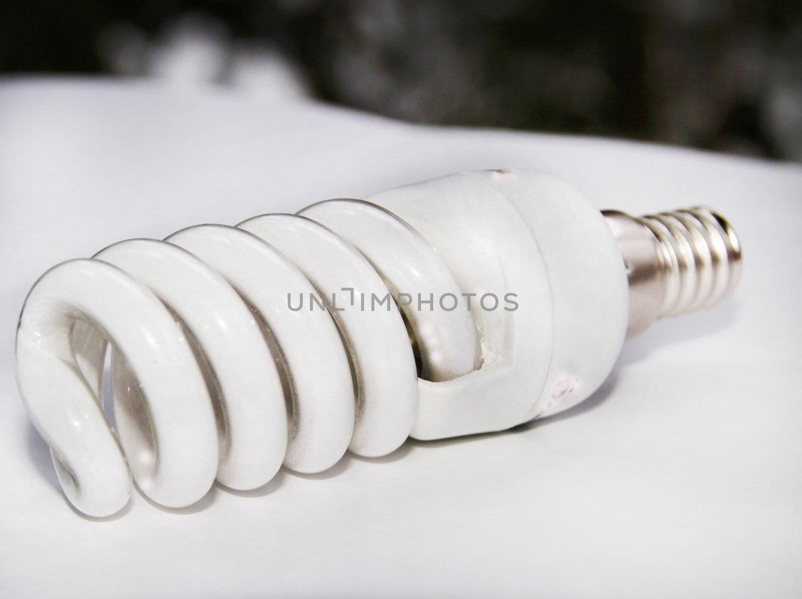 Energy-saving bulb by a spiral isolated  on  white background