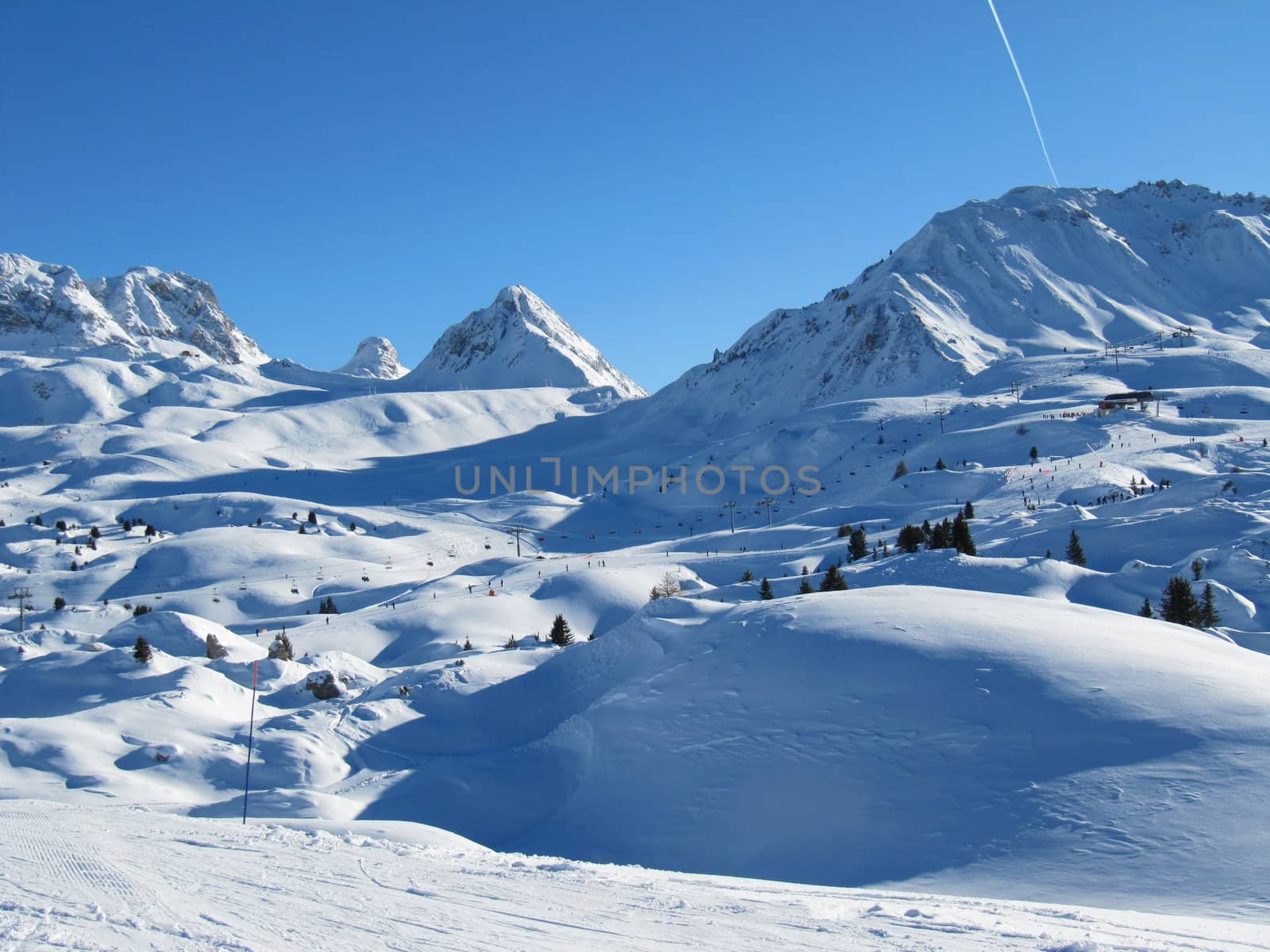 Alpine scene, blue sky over a mountain by chrisga