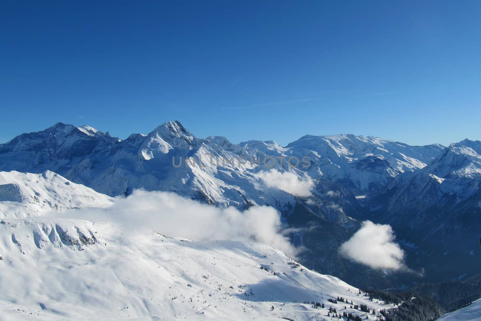 Alpine scene, blue sky over a mountain by chrisga