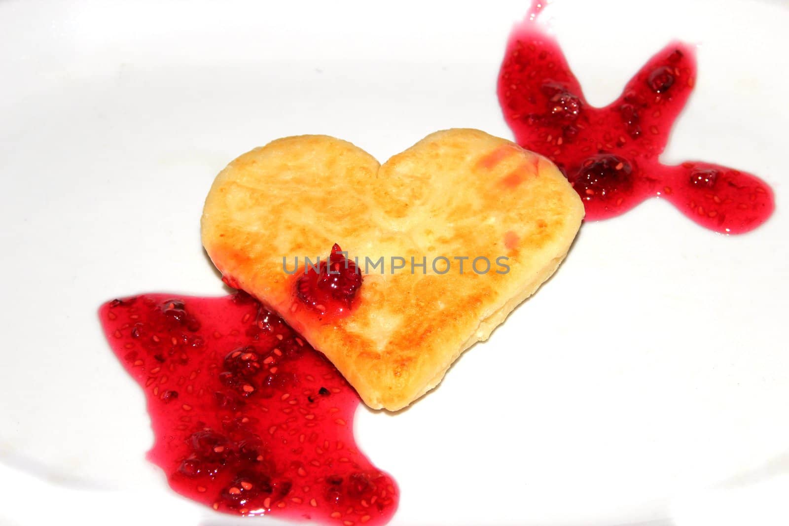 Cheese pancakes in form hearts. Isolated on white background. Love