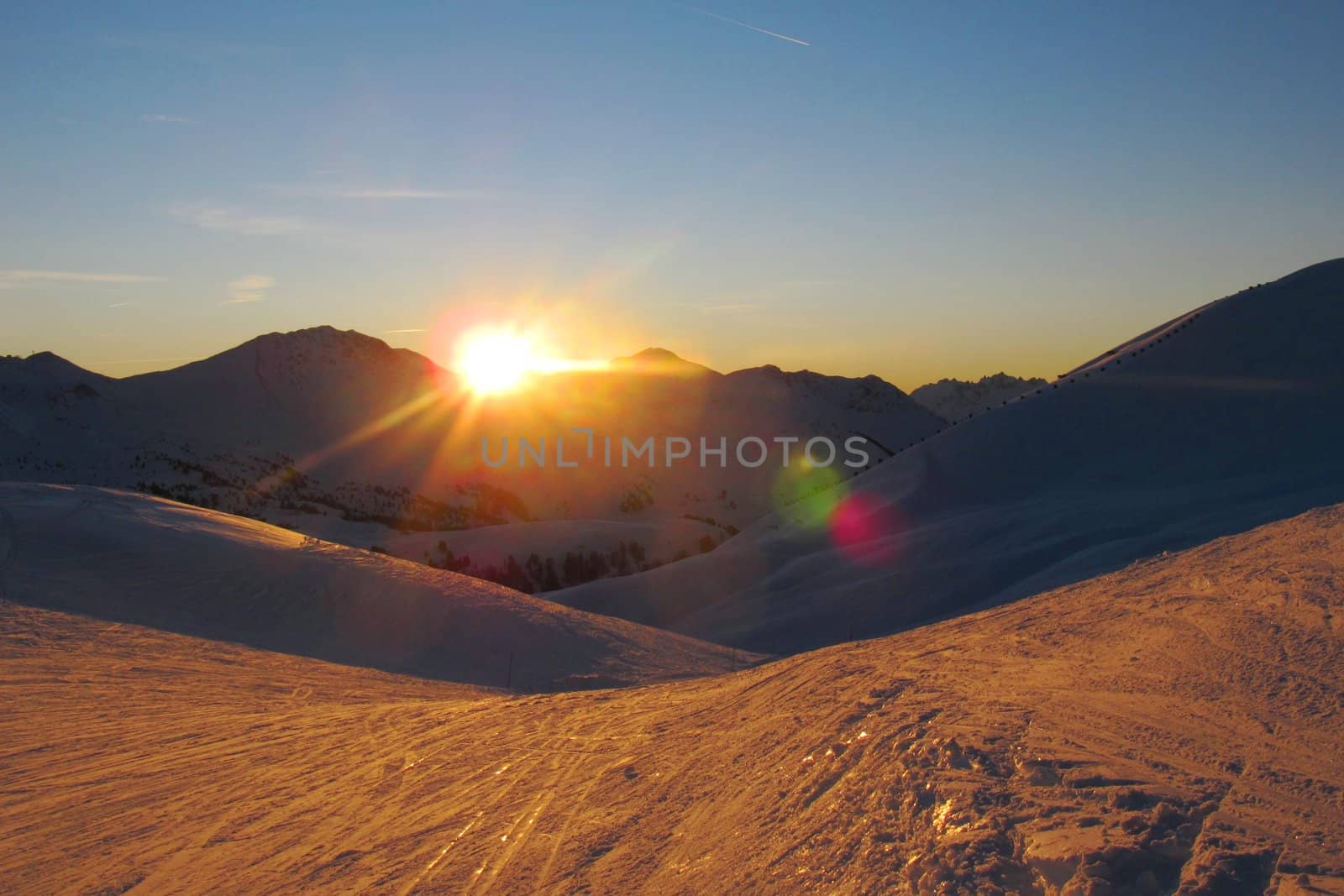 Sun setting over an alpine scene