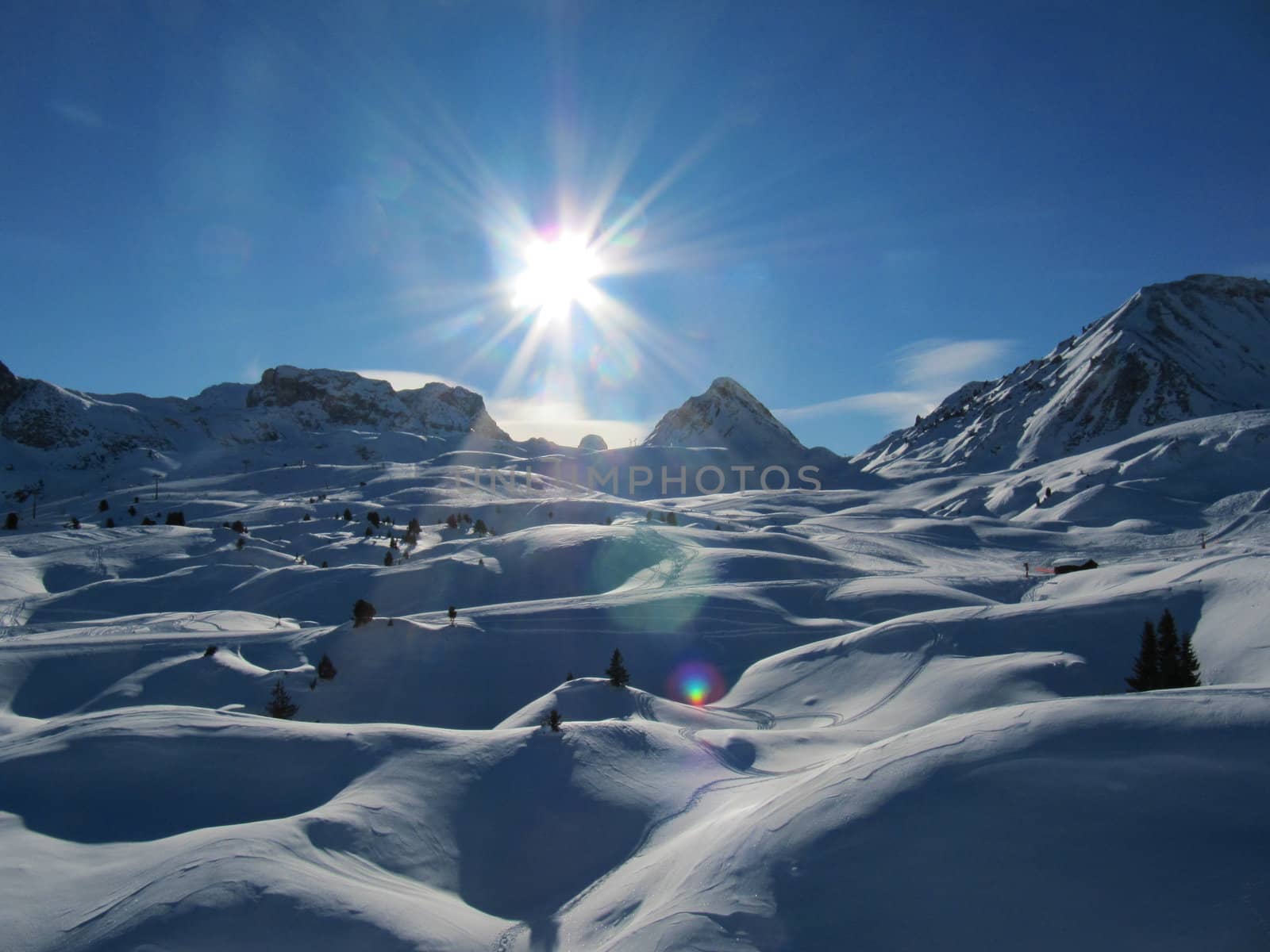 Alpine scene, blue sky over a mountain by chrisga