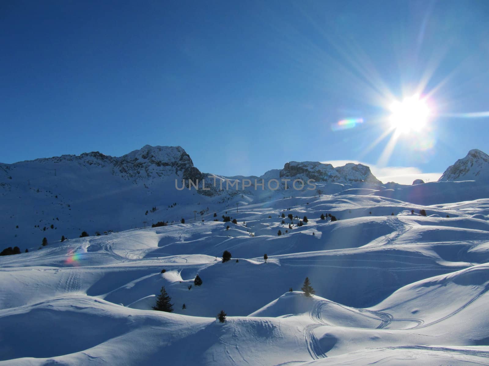 Alpine scene, blue sky over a mountain by chrisga