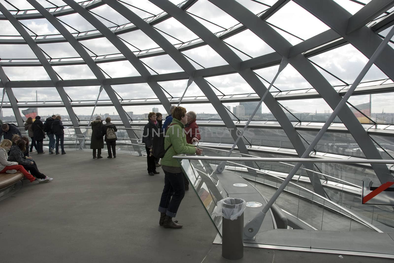 people in the Cupola on top of the Reichstag building in Berlin