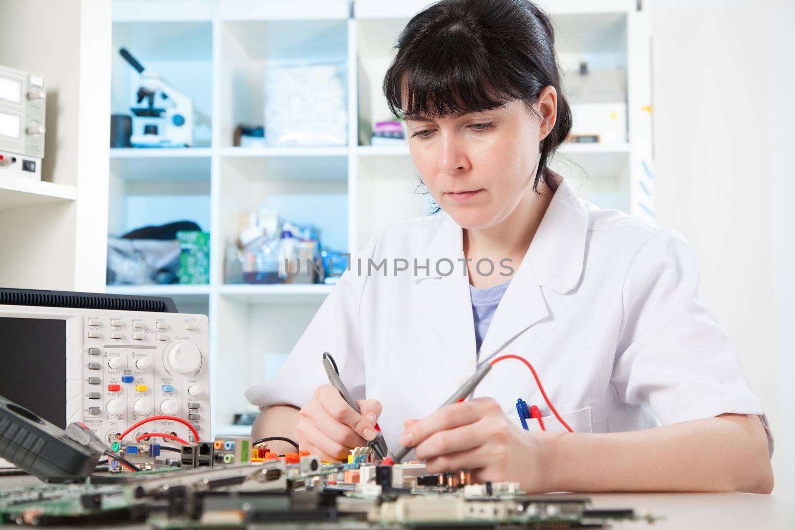 Girl debugging an electronic precision device