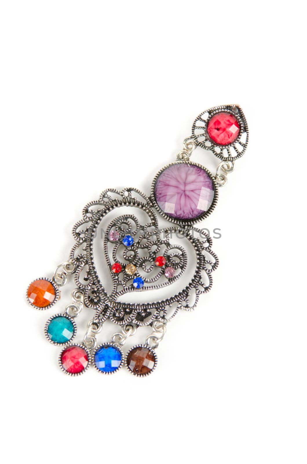 brooch with different gems isolated on a white