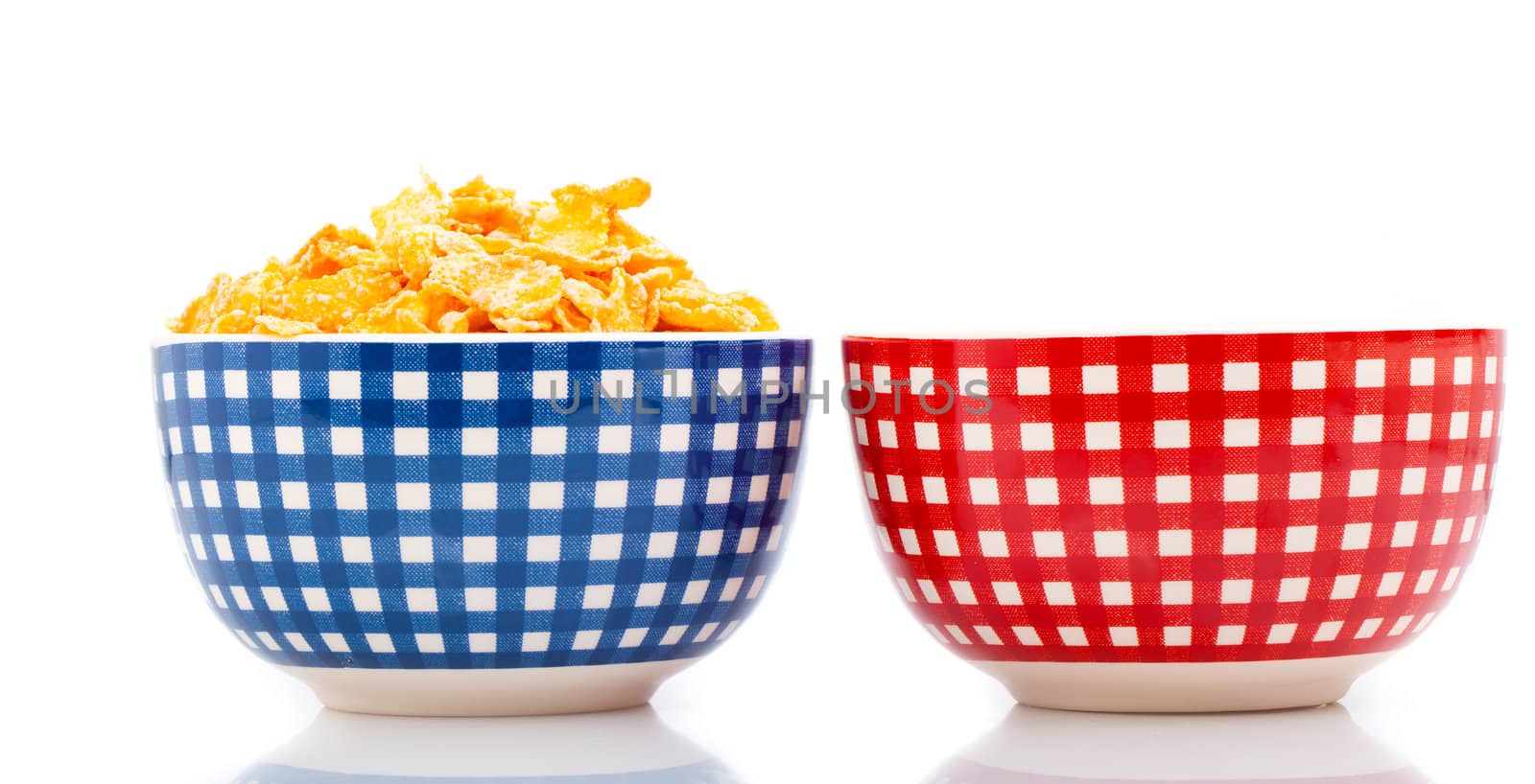 fresh cereal corn flakes in a bowl, isolated on white background.