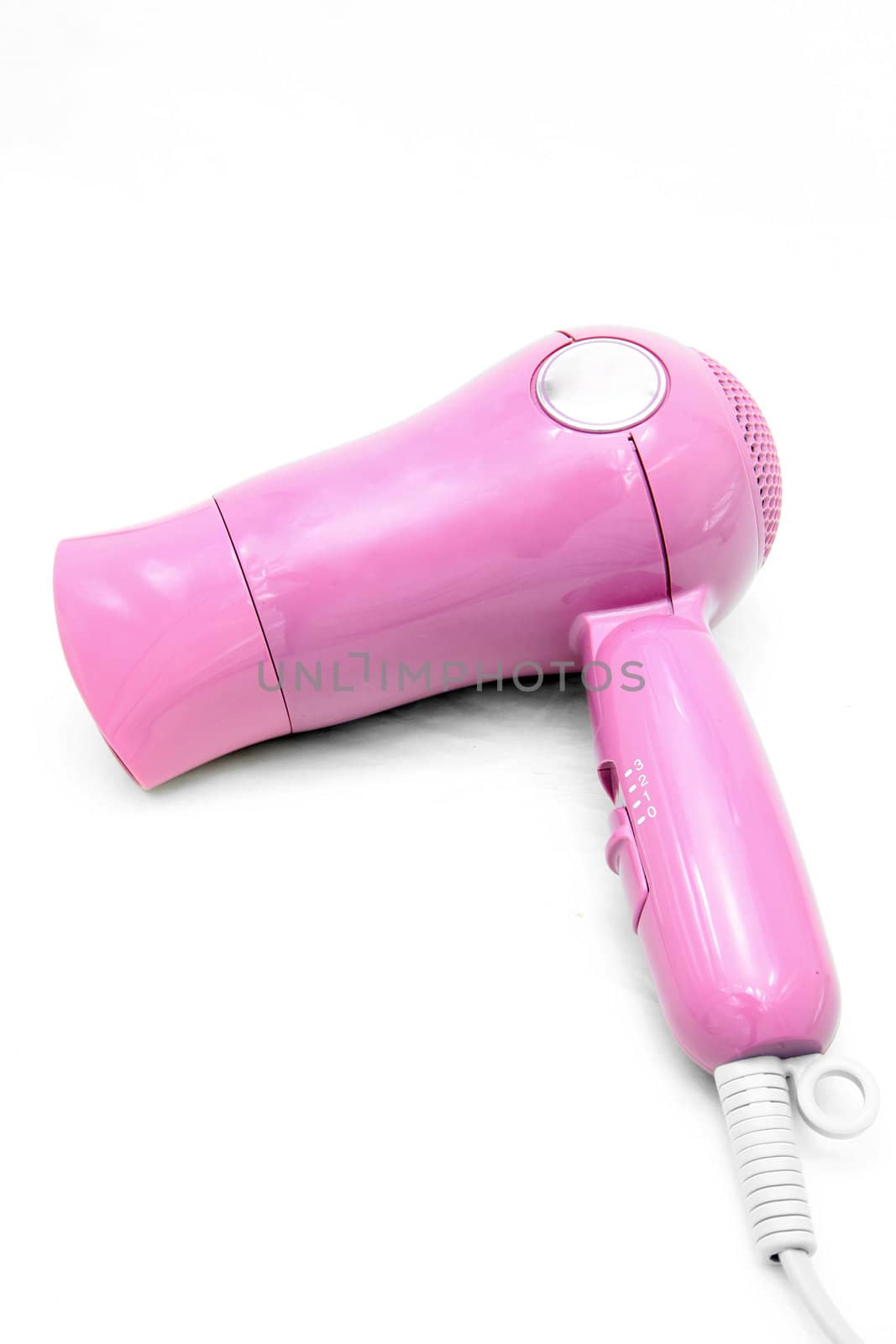 studio shot of pink electronic fashion hair dryer isolated on white background