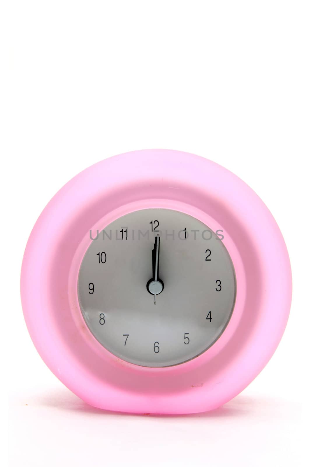 pink round modern alarm clock front perspective