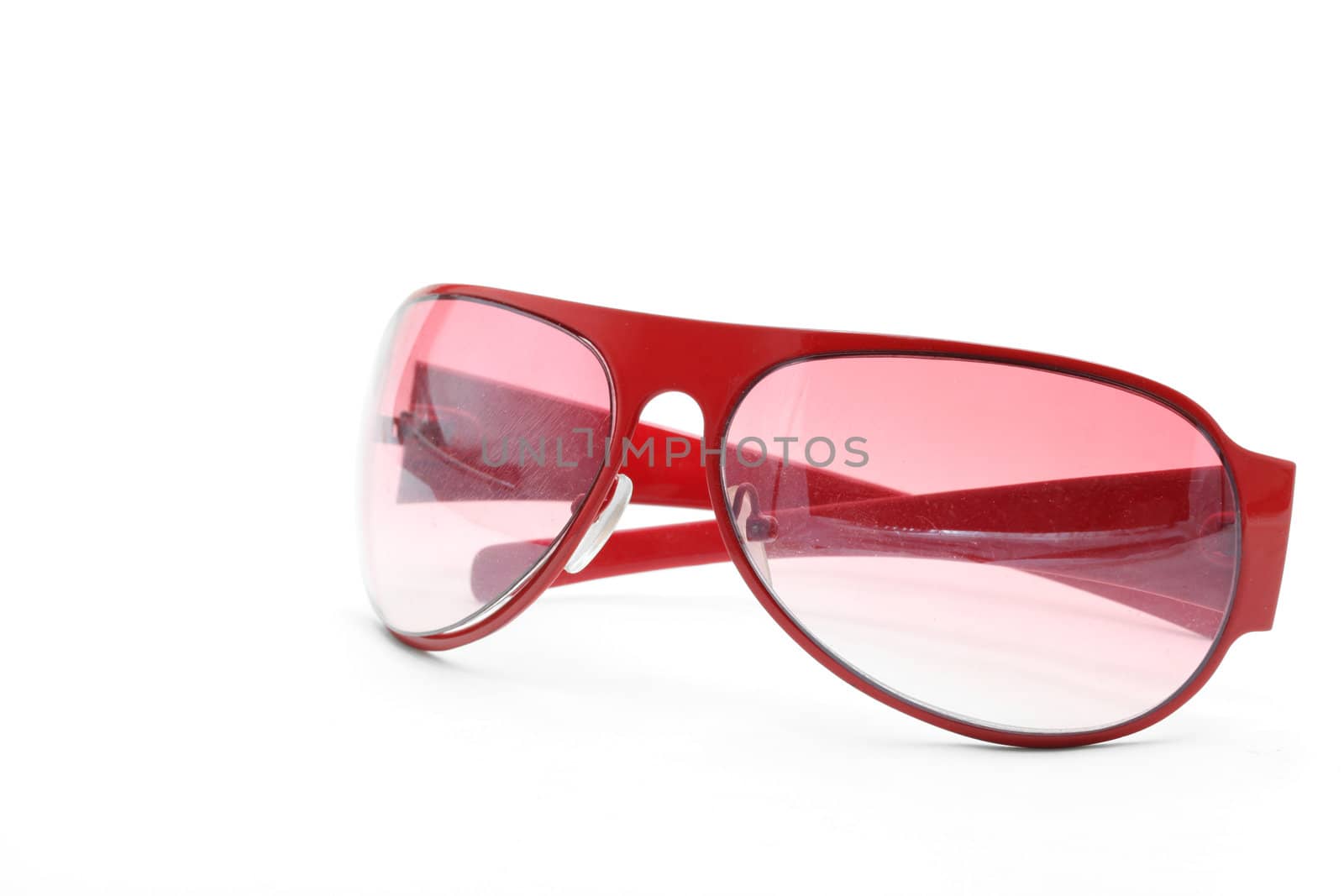 isolated fashion red sunglasses on white background side perspective