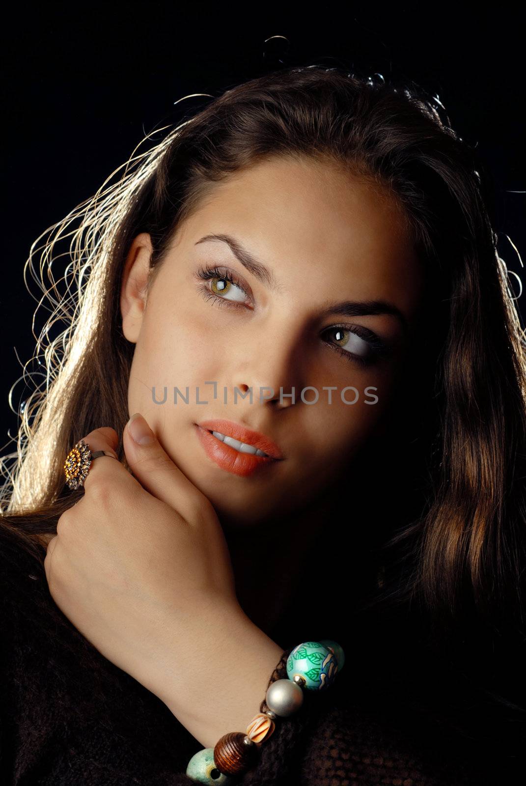 Studio portrait of the pretty woman with jewelry