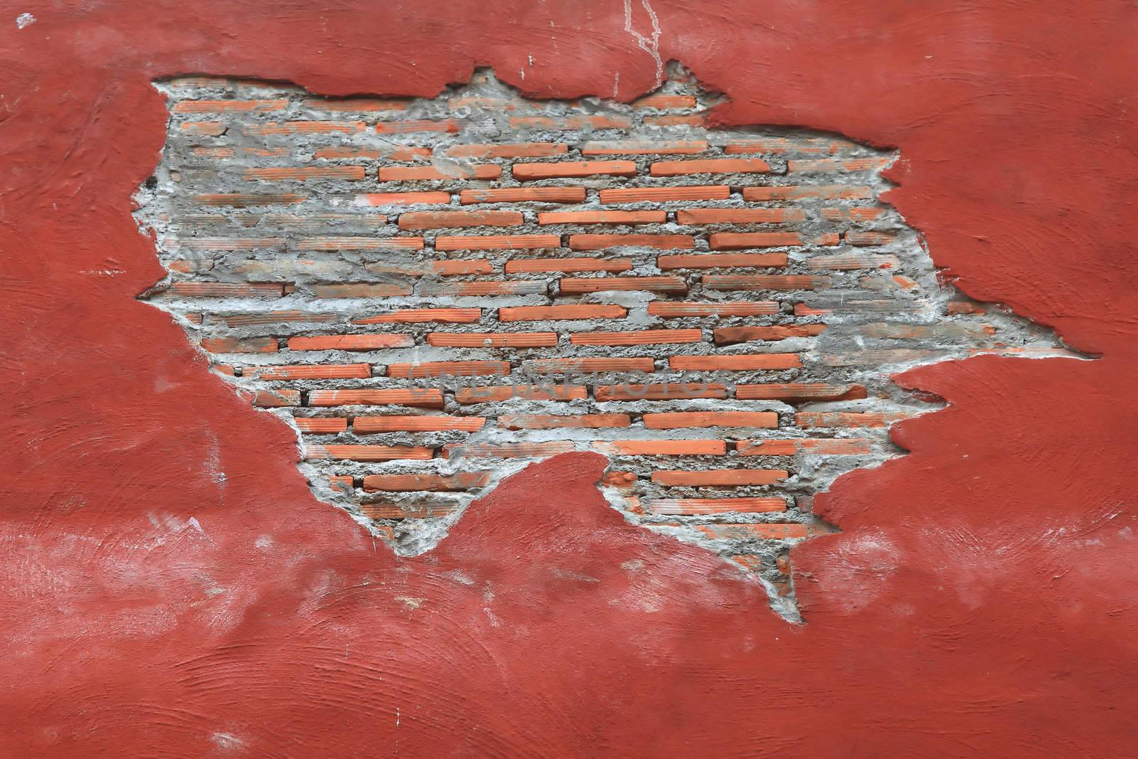 Cracking grunge weathered vintage and fragment of Red brick wall using as background