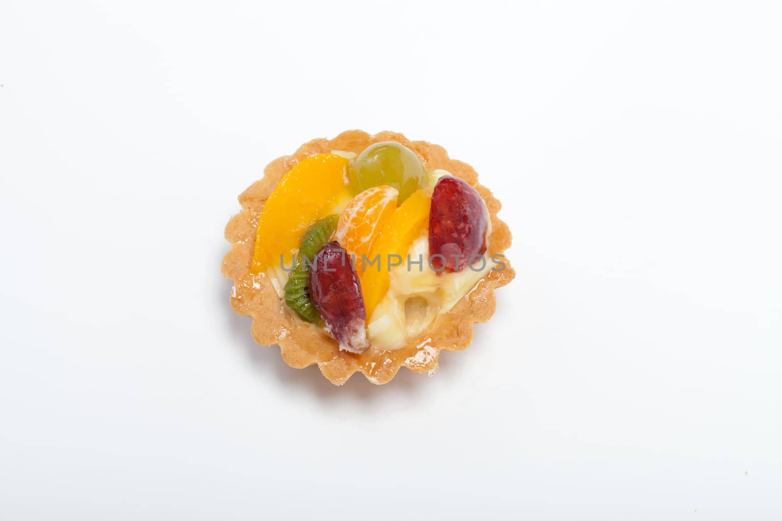 sweet cake with fruits isolated on white