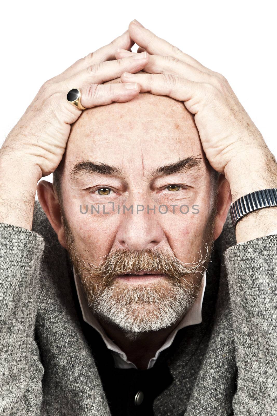 An old man with a grey beard is hopeless