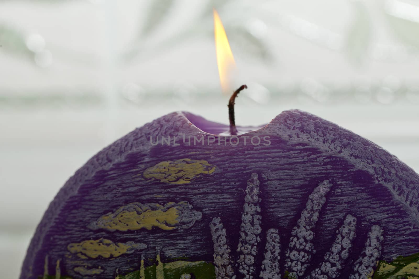 Candle with lavender flowers. Aromatherapy concept 