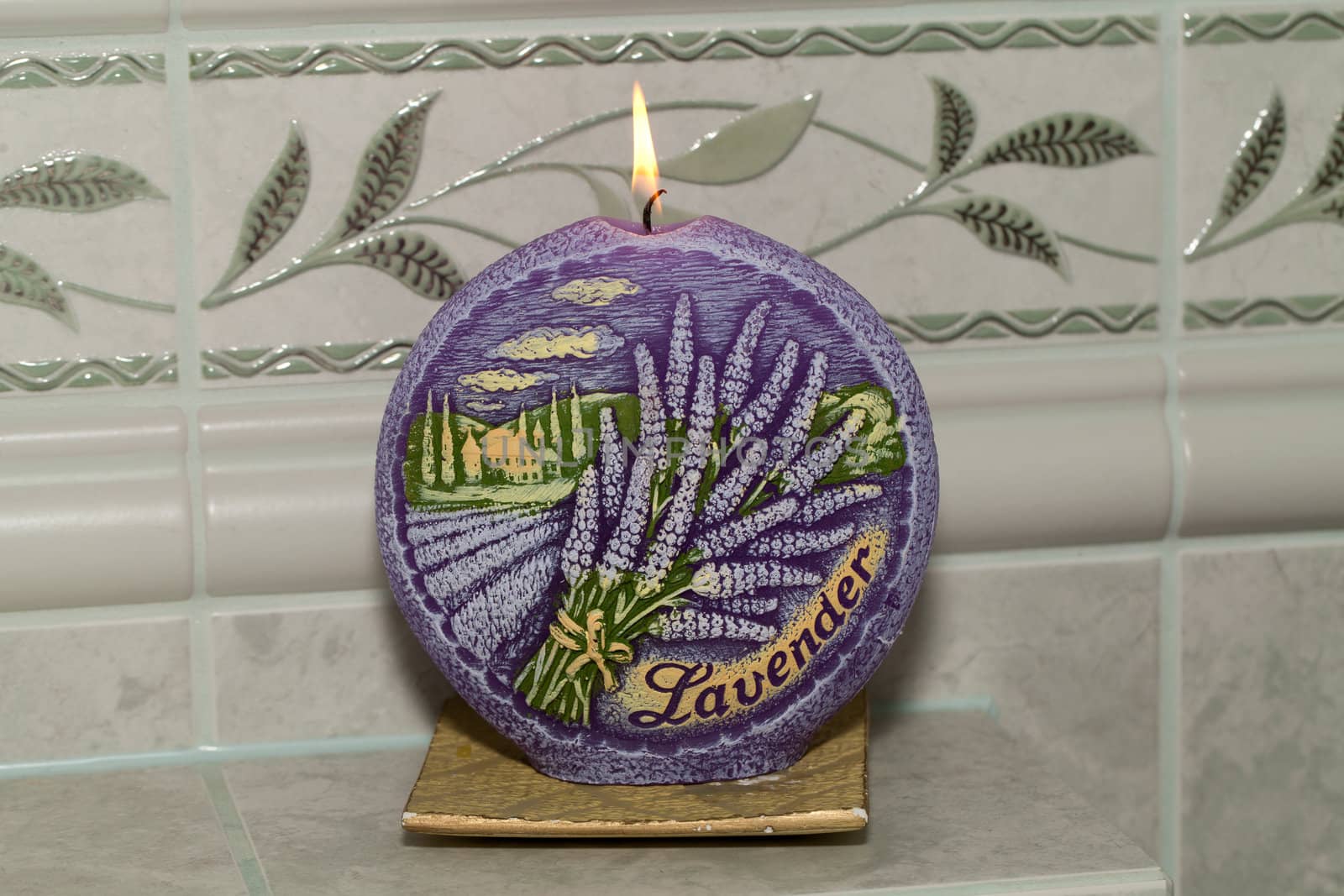 Candle with lavender flowers. Aromatherapy concept 