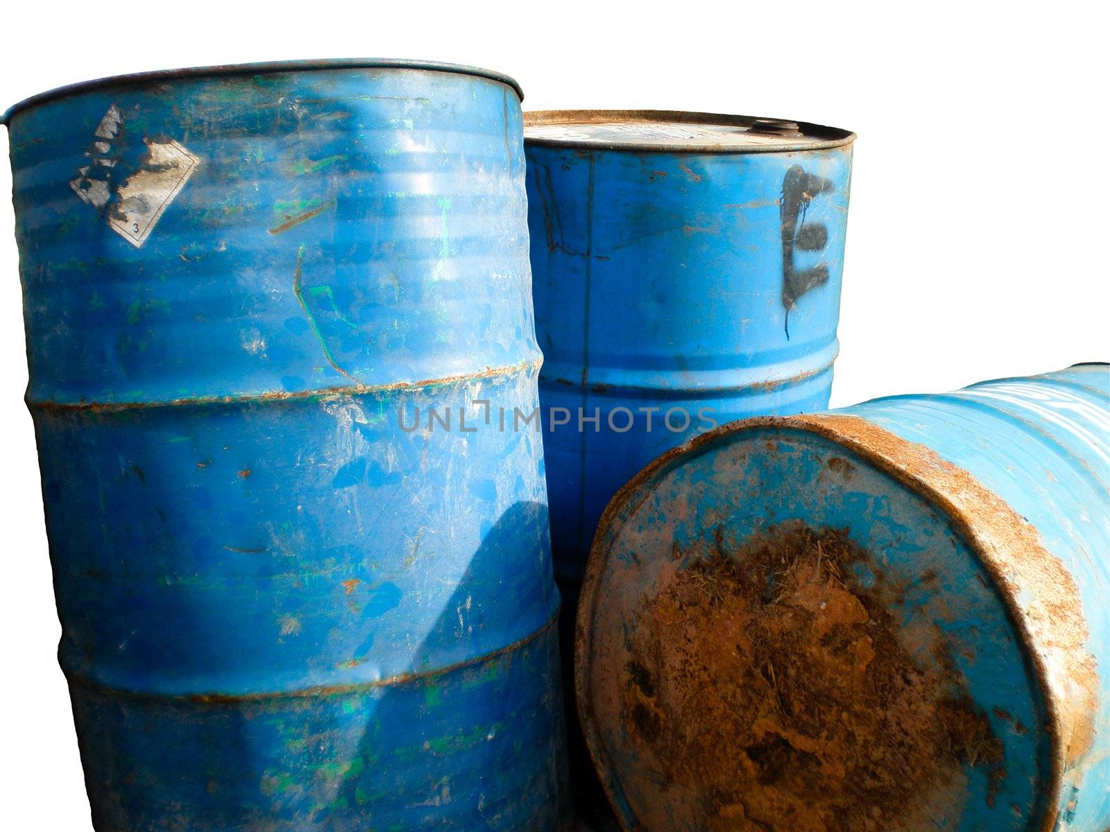 Three stained and rusty barrels on a white background