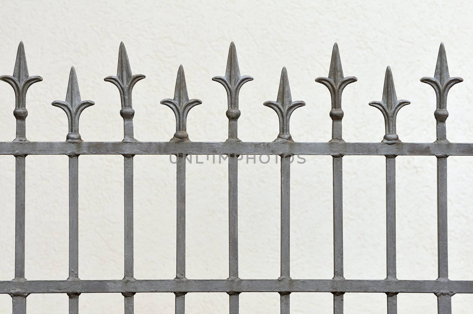 Wrought iron fence with decotative arrows