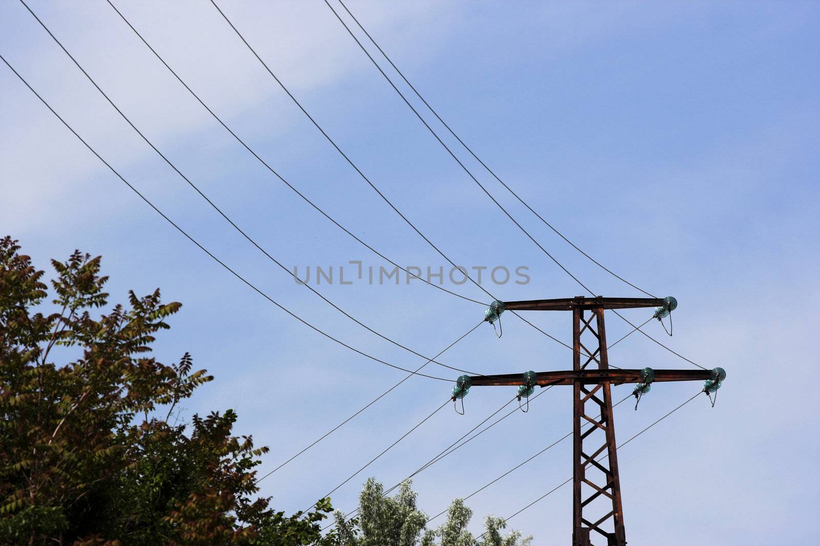 A distribution line over blue sky