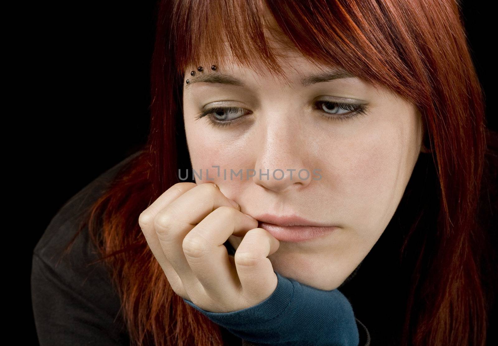 Redhead girl crying and feeling sad and anxious